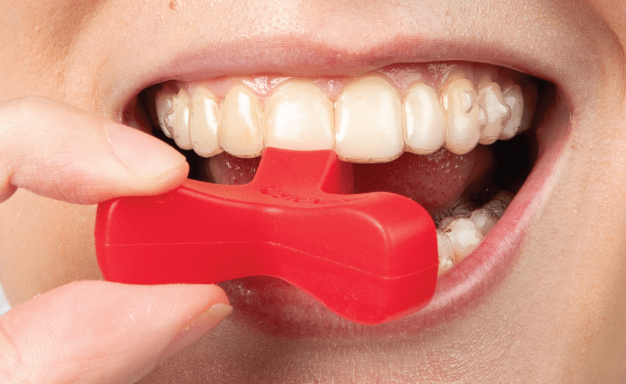 Front, close-up view of Red Munchies® Maxx engaged with incisor
